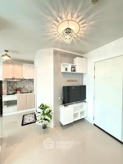 Modern living room with elegant lighting and open kitchen layout