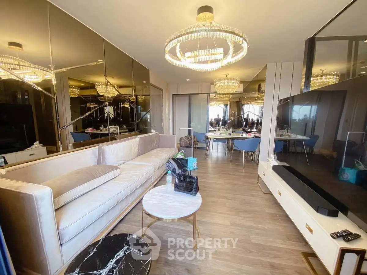 Luxurious living room with elegant chandelier and modern decor