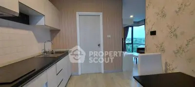 Modern kitchen with sleek design and scenic view from window