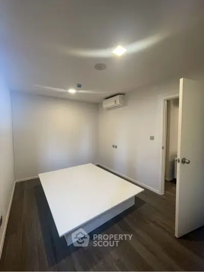 Modern minimalist room with sleek design and neutral tones