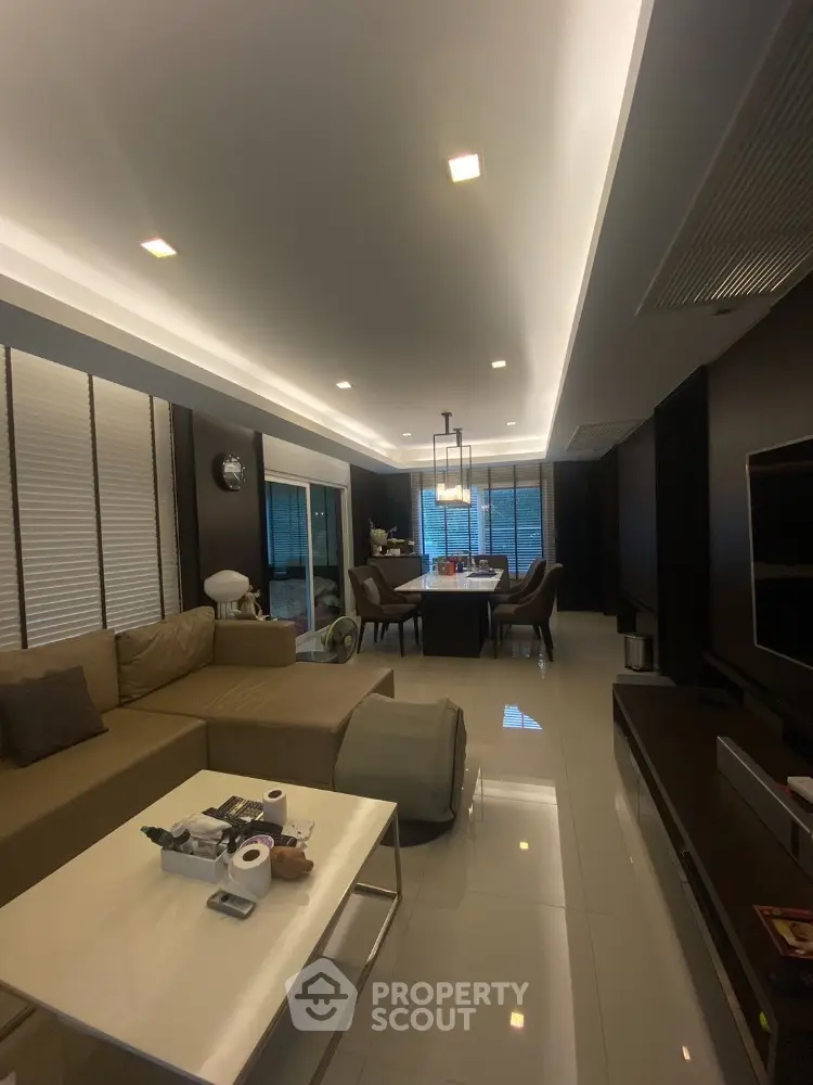 Luxurious modern living room with elegant dining area and ambient lighting