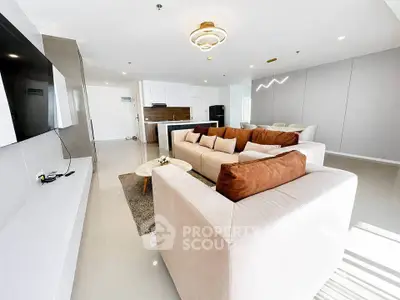 Spacious modern living room with elegant decor and open kitchen layout