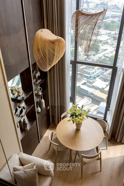 Modern living room with high ceiling and city view, featuring elegant wooden decor and stylish lighting.