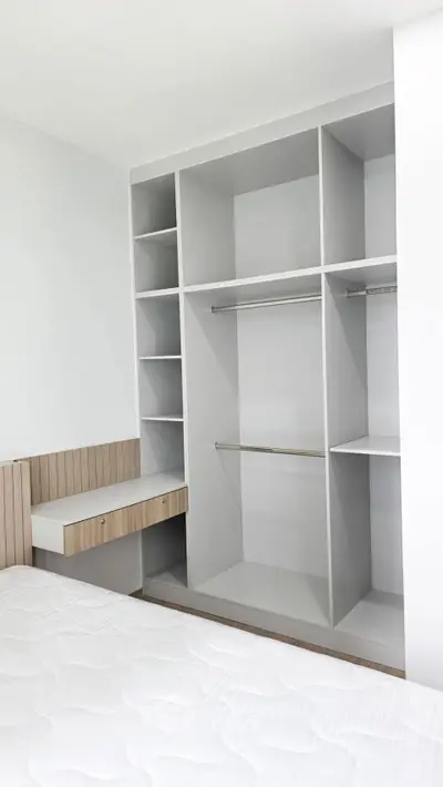 Spacious bedroom with built-in closet and modern design
