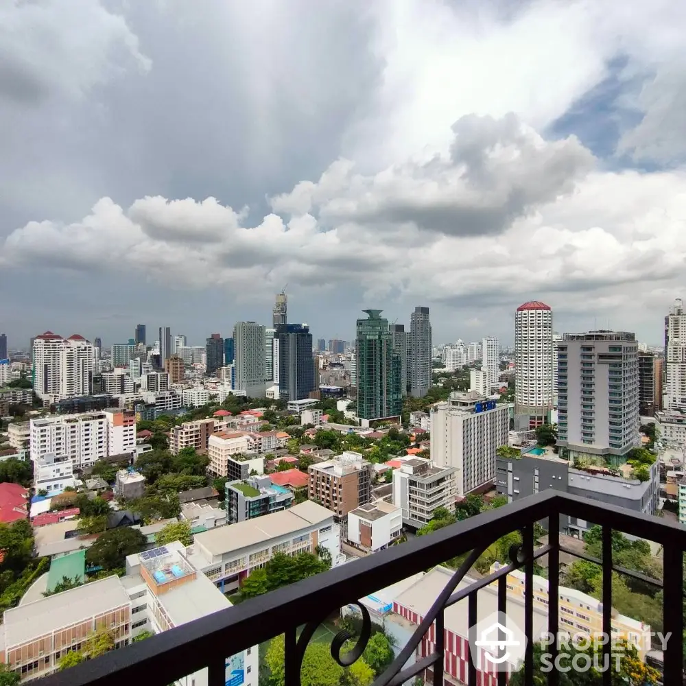 Stunning cityscape view from a high-rise balcony overlooking urban skyline