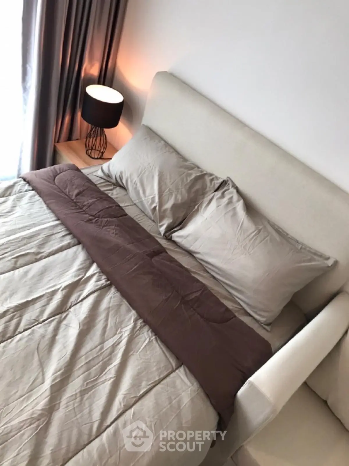 Cozy bedroom with modern decor and soft lighting