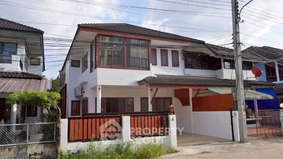 Charming two-story house with modern design in a suburban neighborhood.