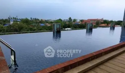 Luxurious rooftop infinity pool with stunning panoramic views of the city skyline.