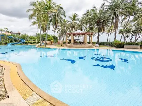 Luxurious resort-style swimming pool with palm trees and dolphin designs, perfect for relaxation and leisure.