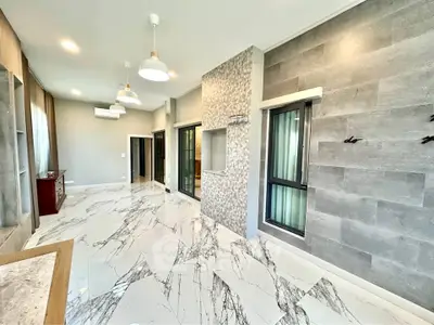 Spacious modern living room with marble flooring and stylish lighting