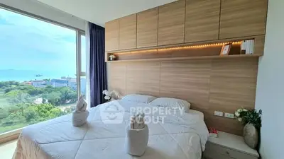 Luxurious bedroom with stunning ocean view and elegant decor