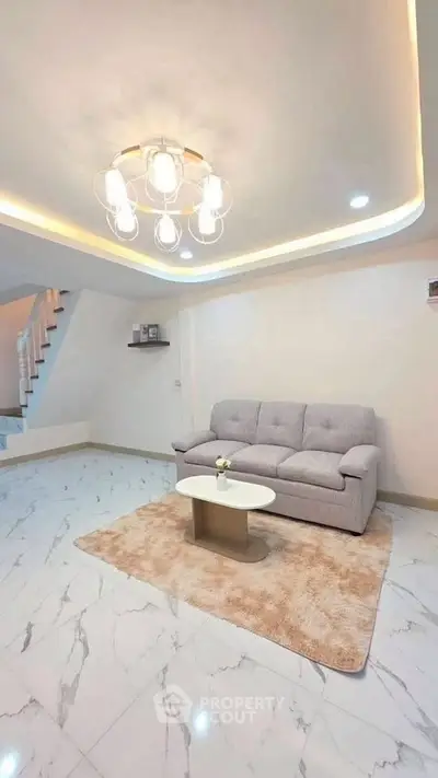 Modern living room with elegant lighting and cozy sofa on marble floor
