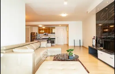 Spacious modern living room with open kitchen and stylish decor