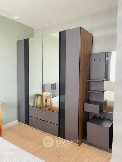 Modern bedroom with sleek wardrobe and stylish decor