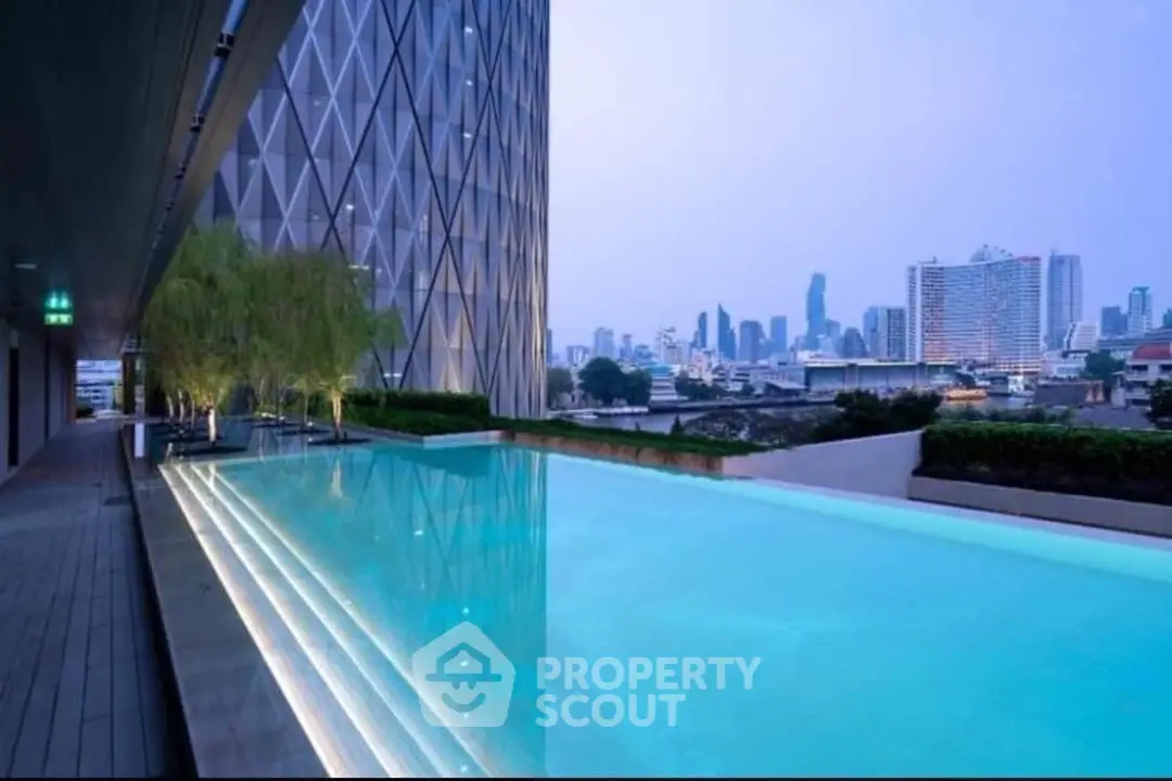 Luxurious rooftop pool with stunning city skyline view at modern high-rise building.