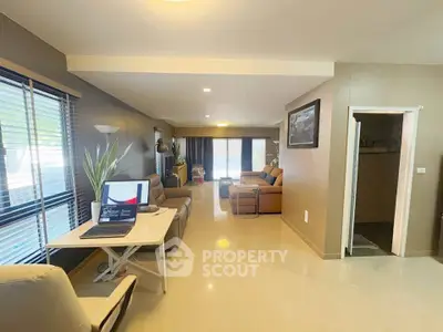 Spacious living room with modern decor and natural light