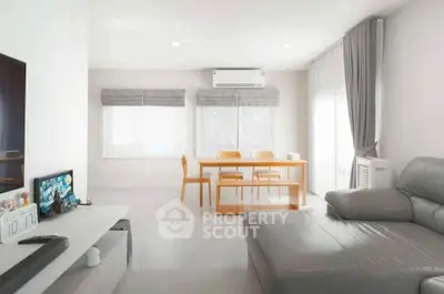 Spacious modern living room with sleek furniture and natural light