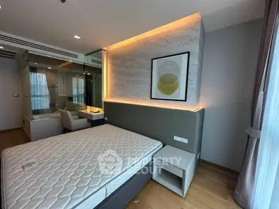 Modern bedroom with stylish decor and large window for natural light
