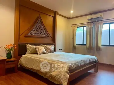 Elegant bedroom with wooden accents and natural light