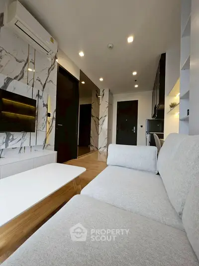 Modern living room with marble accents and sleek furniture design