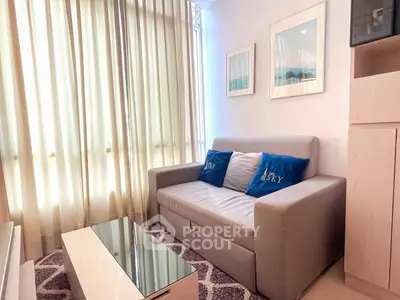 Cozy living room with modern sofa and stylish decor, perfect for relaxation and comfort.