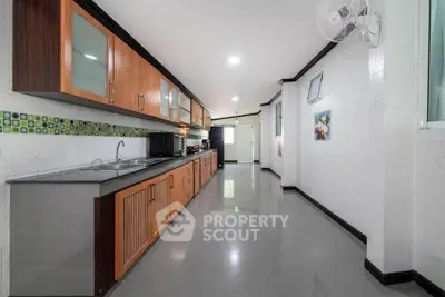 Spacious modern kitchen with sleek cabinets and ample counter space