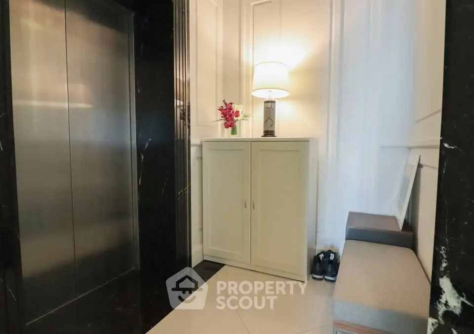 Elegant elevator lobby with stylish decor and seating area