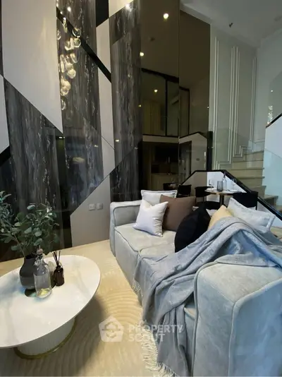 Luxurious modern living room with high ceilings and elegant decor