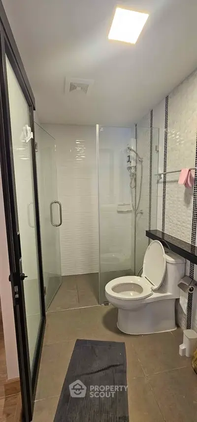 Modern bathroom with glass shower and sleek design