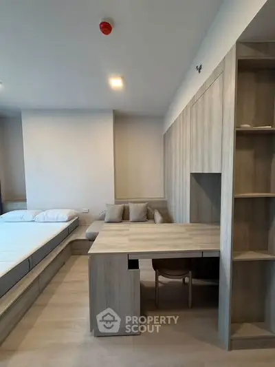 Modern bedroom with integrated workspace and minimalist design