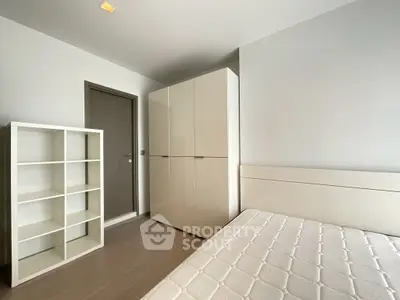 Modern minimalist bedroom with sleek wardrobe and shelving unit