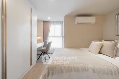 Elegant bedroom with cozy decor and natural light