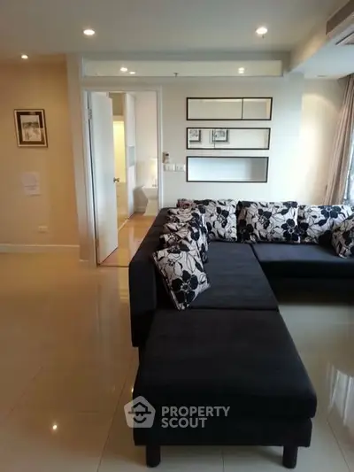 Spacious living room with modern sectional sofa and elegant decor