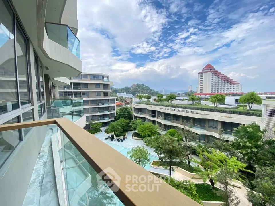 Stunning balcony view overlooking lush gardens and modern architecture