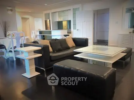 Spacious modern living room with sleek furniture and open layout, perfect for entertaining.