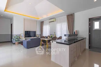 Spacious modern living room with open kitchen and elegant decor