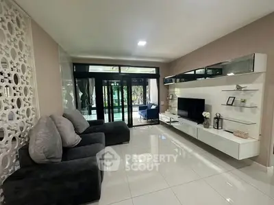 Modern living room with sleek furniture and garden view