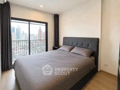 Modern bedroom with city view and stylish decor in urban apartment