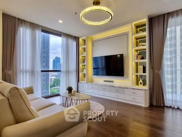 Luxurious living room with modern decor and city view, featuring elegant lighting and floor-to-ceiling windows.