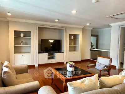 Spacious living room with elegant furniture and built-in TV unit, perfect for modern living.