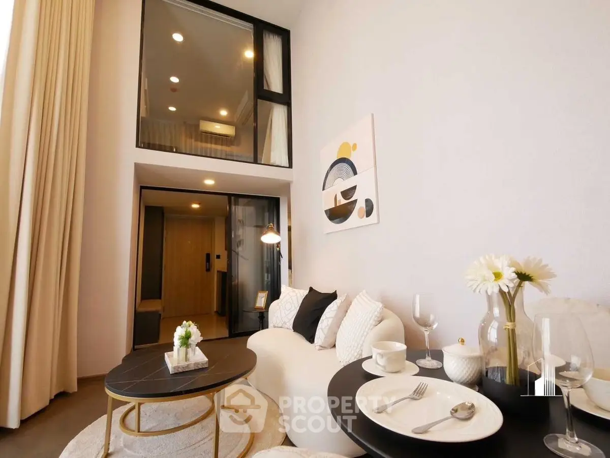 Modern living room with high ceiling and elegant decor