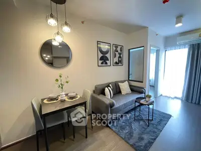 Modern living room with stylish decor and cozy seating area in a contemporary apartment.