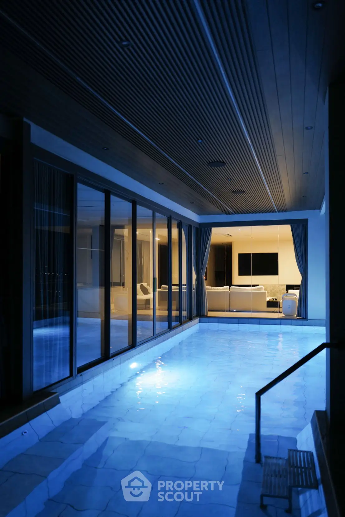Luxurious indoor pool with modern design and ambient lighting