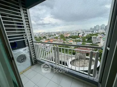 Stunning balcony view from high-rise apartment overlooking cityscape, perfect for urban living.