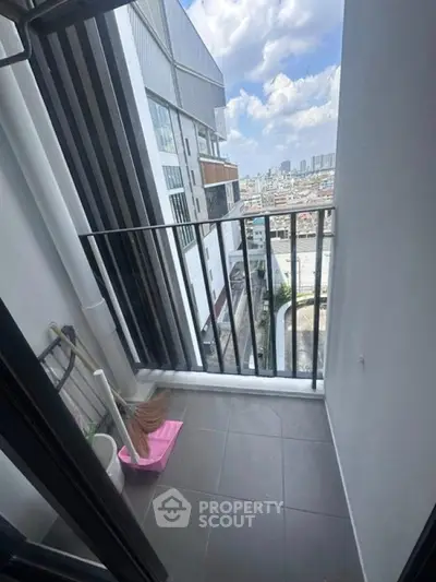 Modern balcony with city view in high-rise apartment