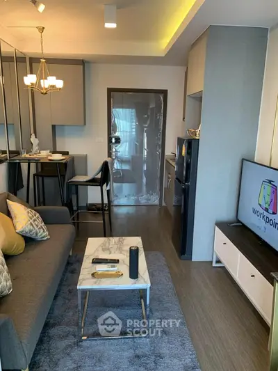 Modern living room with stylish decor, open layout, and sleek furniture in a contemporary apartment.