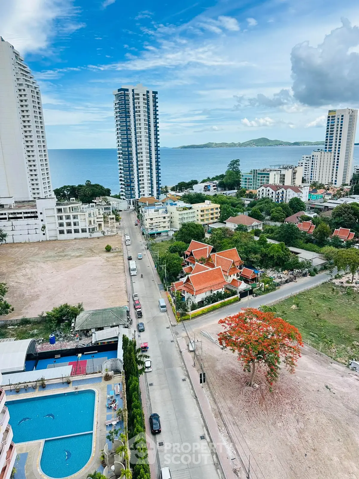Stunning coastal cityscape with ocean view and high-rise buildings, perfect for urban living.