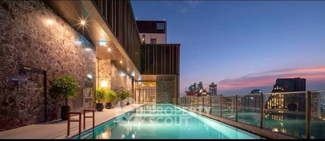 Luxurious rooftop pool with stunning city skyline view at sunset.