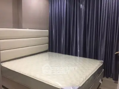 Modern bedroom with elegant bed and luxurious curtains