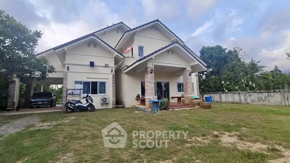 Charming suburban home with spacious yard and covered parking, perfect for family living.